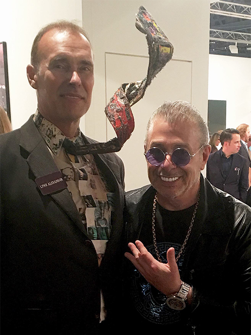Leland, an art collector at Miami's Art Basel VIP Preview with Artist Lynx Alexander.